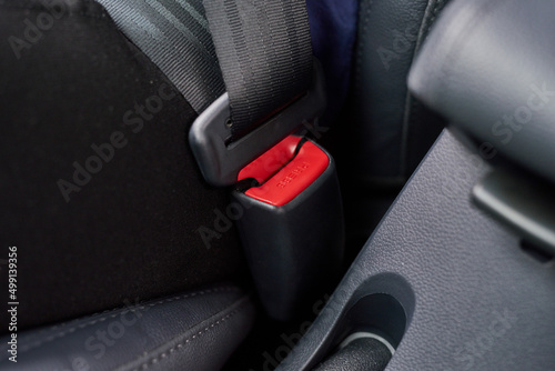 Buckle up. Closeup shot of a seatbelt inside a motor vehicle.