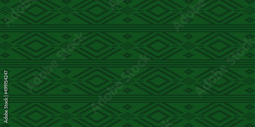 green ethnic seamless pattern. Montley center in blue color. Ornament for textile and fabric. 