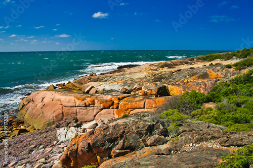 The wild coast, with red lichen covered rocks, of Donington Peninsula, part of Lincoln National Park, Eyre Peninsula, South Australia 