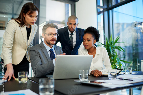 We have so much potential to improve our profits. Cropped shot of a group of business colleagues meeting in the boardroom.