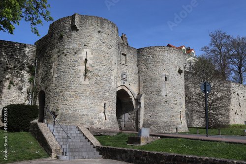 View of Port Gayole gate house and the medieval ramparts of Boulogne-sur-mer, in the Pas de Calais region of northern France. Sunny spring day with blue sky.