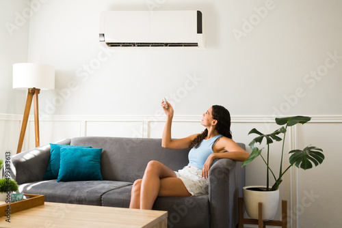 Happy woman using her new air conditioning