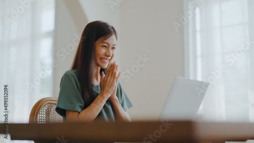 Excited asian female feeling euphoric celebrating online win success achievement result, young woman happy about good email news, motivated by great offer or new opportunity, passed exam, got a job
