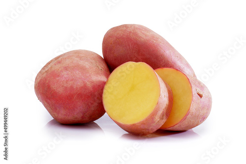 Clean ripe potato tubers isolated on white background. Washed red potato tubers.