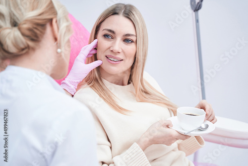 Aesthetic clinic client having consultation with dermatologist