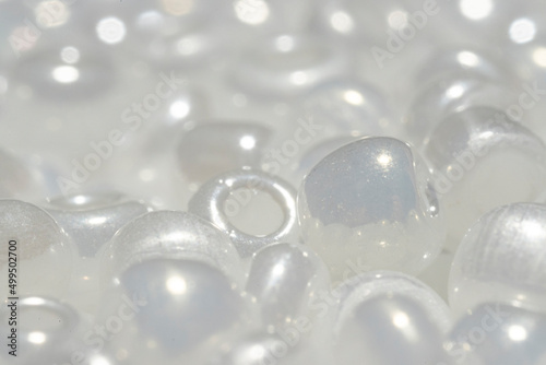 Background beads macro photo. White beads close-up.