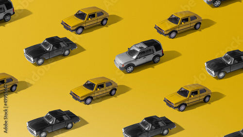 Toy cars pattern on yellow background. Minimal concept of car market crash