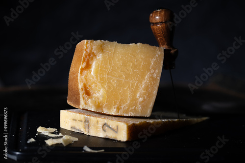 Parmesan cheese on wooden board