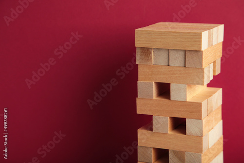 Blocks of wood on red background, Strategy game as a business plan for team work
