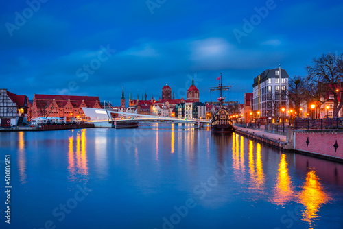 Beautiful architecture of Gdansk old town reflected in the Motlawa river at dawn, Poland