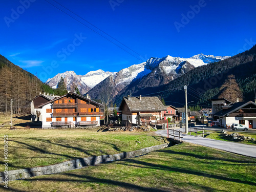 View of the village of Macugnaga, small town at the extreme northern tip of Piedmont, on the border with Switzerland. In the background the mountain peaks of the Western Alps.