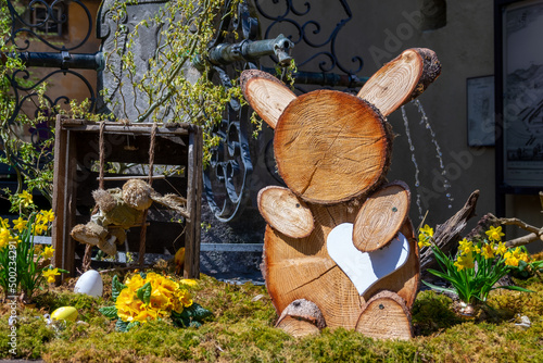 Rustic Easter decor with a wooden rabbit in a village in Alsace region, France