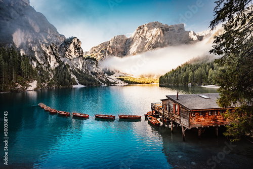Boats on the Braies Lake, Pragser Wildsee in Dolomites mountains, Sudtirol, Italy dolomite.