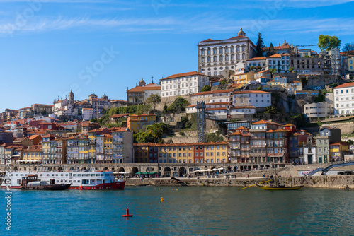 Cityscape of the city of Porto, Douro river with its old boat and its typical colored houses on the water's edge. Portugal. Europe.