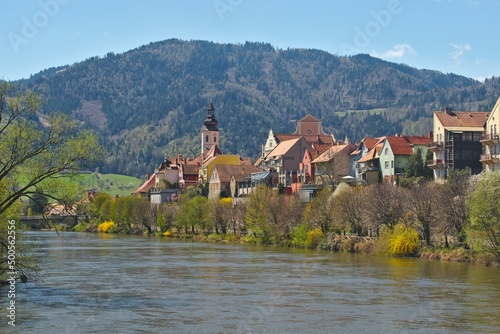 Frohnleiten, - small town above Mur river in Styria, Austria. View at Parish church, town and river Mur. Famous travel destination.