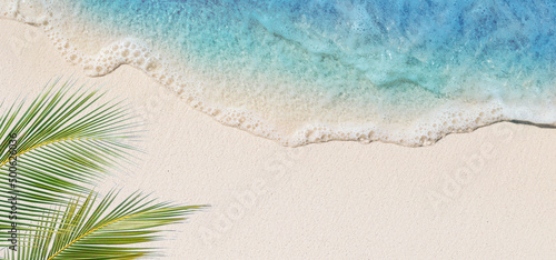 Tropical beach background with sea waves, white sand and foam - summer holiday panoramic top view background. Travel and beach vacation, copy space for text.