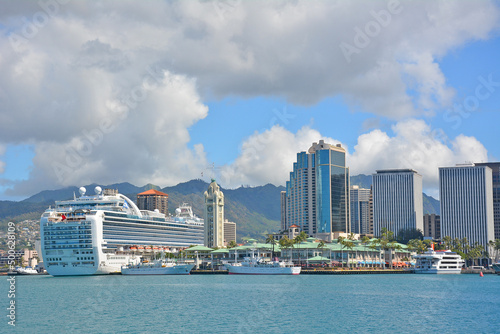 View across Honolulu harbor of downtown Honolulu condos and cruise ship at Aloha Tower Marketplace on Oahu, Hawaii. 