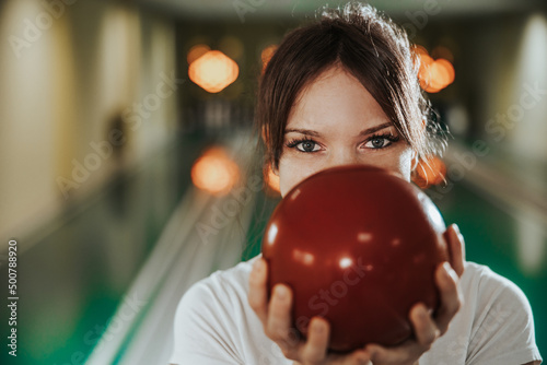 Young Woman Having Fun In A Bowling Alley