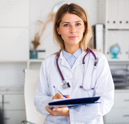 adult doctor female working in uniform in room