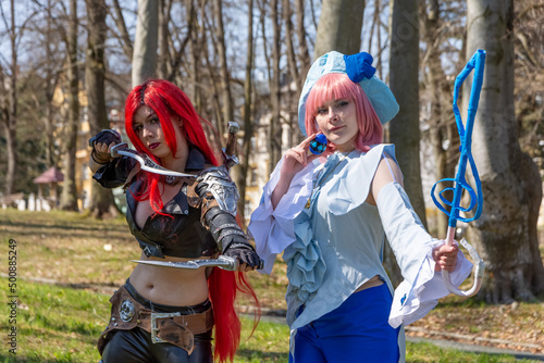 two women as cosplay figures in a forest