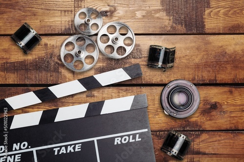 Film clapperboard, vintage camera and photo. Concept of entertainment industry worldwide award