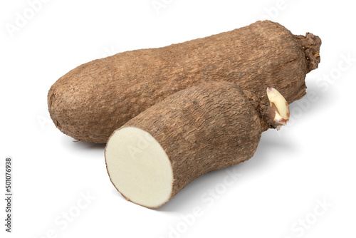  Whole and halved raw African yam isolated on white background