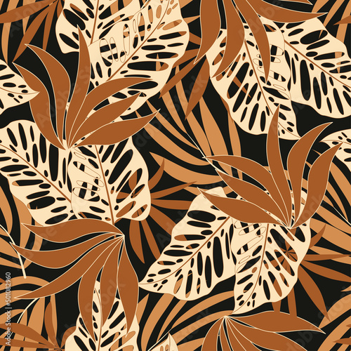 Fashionable seamless tropical pattern with bright plants and leaves on a black background. Jungle leaf seamless vector floral pattern background. Seamless exotic pattern with tropical plants.