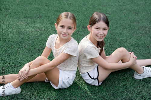 sisterhood. two sisters or friends spending time outdoors on sunny summer day. bff, sibling, girlfriend. millennial teen