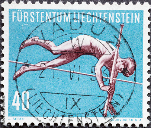 LICHTENSTEIN - CIRCA 1956: a postage stamp from LICHTENSTEIN , showing a pole vaulting athlete. Circa 1956