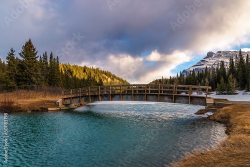 Sunlit Clouds Over A Banff Mountain Park Lake