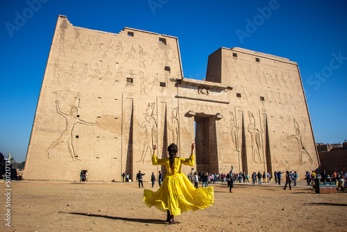 Woman looking at the Temple of Edfu, Egypt