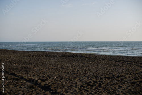 Ureki, Georgia, black sand on the beach sea 