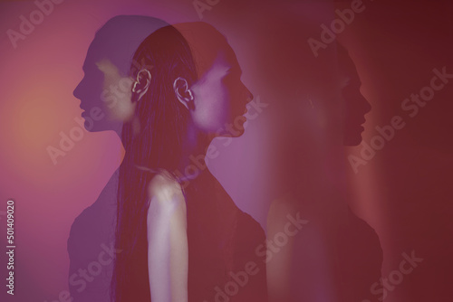 bipolar mental disorder. Double face. Split personality. Conceptual mood disorder. Dual personality concept. 2 silhouettes of a female head. mental health. Imagination. red