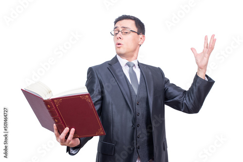 Man in formal wear reciting in studio