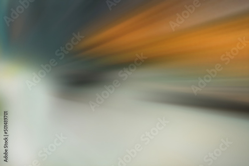 Abstract blurry background with motion blur in gray and orange