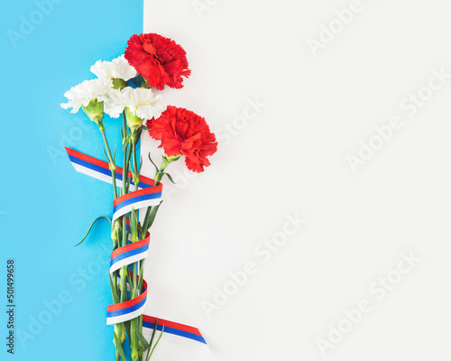 Red and white carnation with Russian flag ribbon