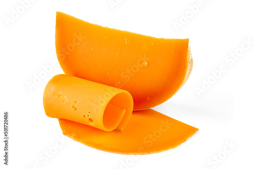Wedge of orange French Mimolette cheese isolated on white background