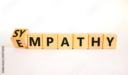 Sympathy or empathy symbol. Turned wooden cubes and changed the concept word Empathy to Sympathy. Beautiful white table white background. Copy space. Psychological sympathy or empathy concept.