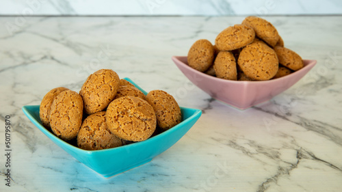 Amaretti cookies in bowl. Small soft Italian traditional sweet-bitter pastry dessert.