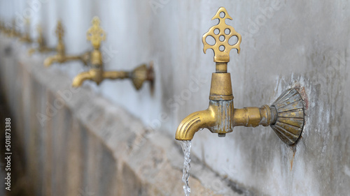 yellow faucet and row fountain
