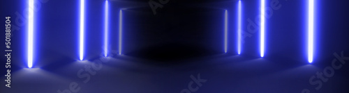 широкоформатный фон в котором два неоновых стержня синих цветов в коридоре с отражением в полу 