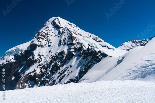 View of snow on the beautiful mountain with blue sky on summer in Jungfrau, Switzerland