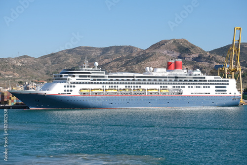 Fred Olsen cruiseship cruise ship liner Borealis Bolette in port of Cartagena, Spain during Mediterranean summer cruising with containers and cranes