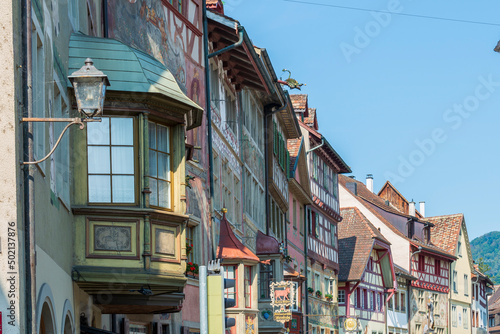 Historical tenement house (apartment building) with facade paintings and half timbered walls in an old town in Swiss city Stein am Rhein in Switzerland 