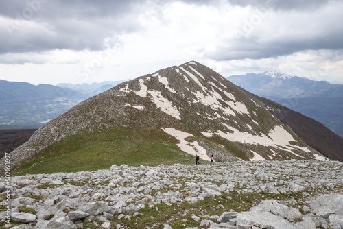 two hikers reach the top of Monte Alpi. Monte Santa Croce, Pizzo Falcone, Lucan Apennines, Basilicata, Italy