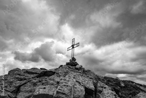 black and white image of the cross on the top of Monte Santa Croce. Monte Alpi, Lucan Apennines, Basilicata, Italy