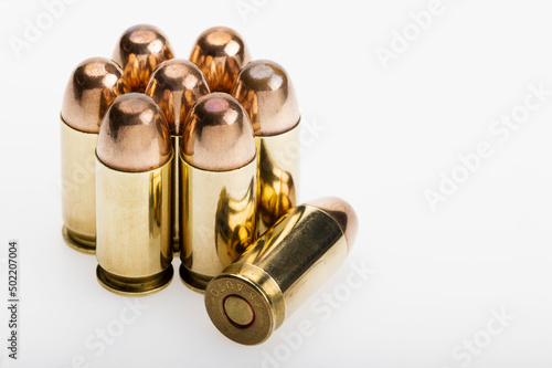 11 mm. or .45 gun bullets , Full metal jacket ammunition on white background