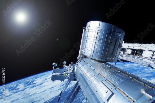 Iss over the planet Earth. Elements of this image furnished by NASA