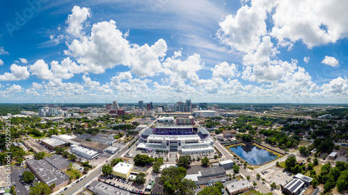 Aerial view of downtown Orlando with the Orlando City Soccer (Lions) stadium in the foreground. The word "Orlando" is spelled out and visible in this image within the soccer stadium. May 2, 2022.