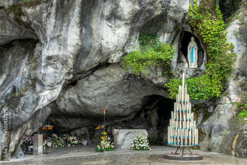 Statue of Virgin Mary in the grotto of Our Lady of Lourdes, France - French famous catholic pilgrimage destination